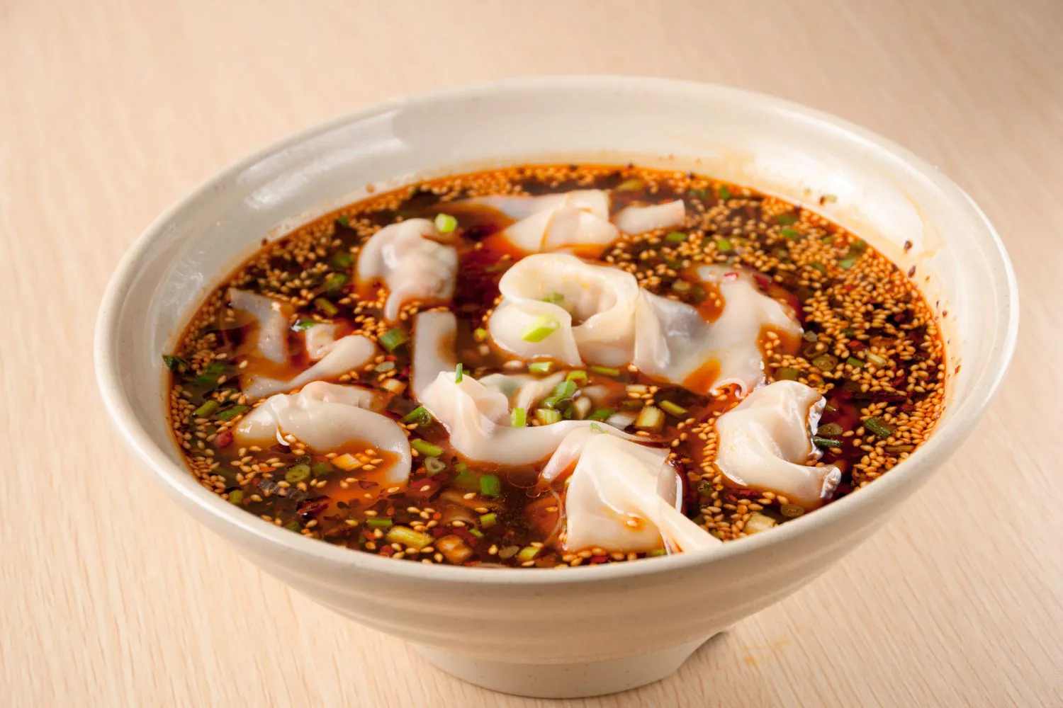 Spicy red oil wontons with sesame at Schuan Kitchen, a Chinese Restaurant in Staten Island